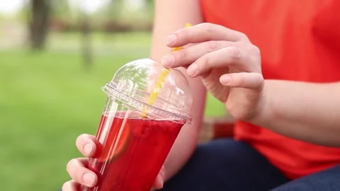 Lemonade in a disposable plastic cup Stock Footage 311109128