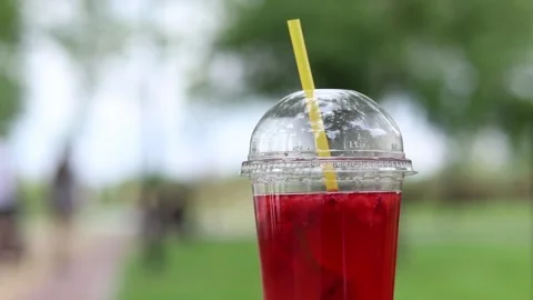 Lemonade in a disposable plastic cup, takeaway drink Stock Footage 311109417