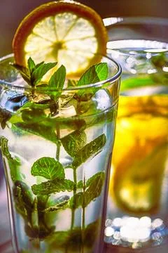 Lemonade in a glass on the table Stock Photos