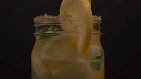 Lemonade Jar with Straw and Mint Rotating Stock-Footage 130989444