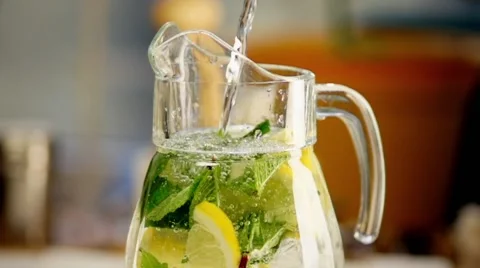 Lemonade with Lemon and Lime pouring in slow motion Stock Footage 54466143