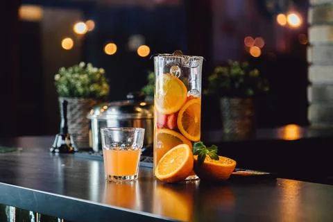 Lemonade from orange and berries in two modern glasses in the form of a can and Stock Photos