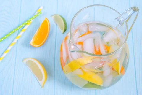 Lemonade pitcher with lemon, orange, lime slices Stock Photos
