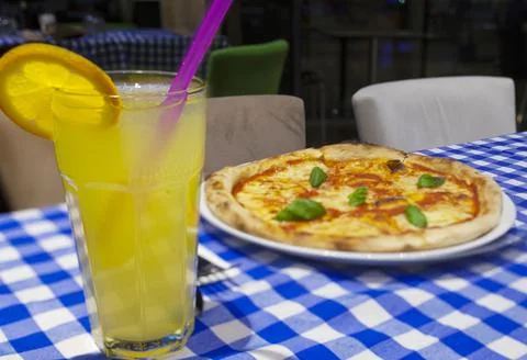 Lemonade with pizza Stock Photos