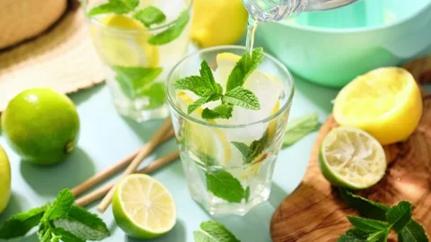 Lemonade. A refreshing summer drink with fresh lemons, mint and lime. Video Stock Footage 243659767