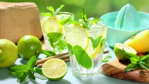 Lemonade. A refreshing summer drink with fresh lemons, mint and lime. Video Stock Footage 243671749
