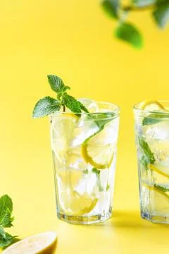 Lemonade on yellow background. Stock Photos