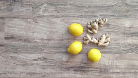 Lemons and ginger root on wooden background Stock Footage 236019714