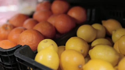 Lemons and oranges in a grocery store Stock Footage