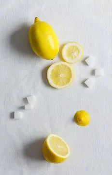 Lemons and sugar cubes Stock Photos