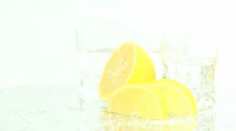 Lemons and tequila on white Stock Footage 8992206