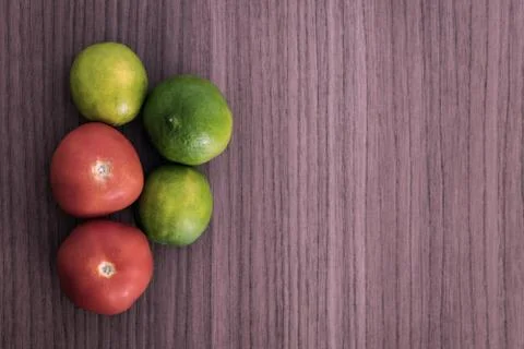 Lemons and tomatoes Stock Photos