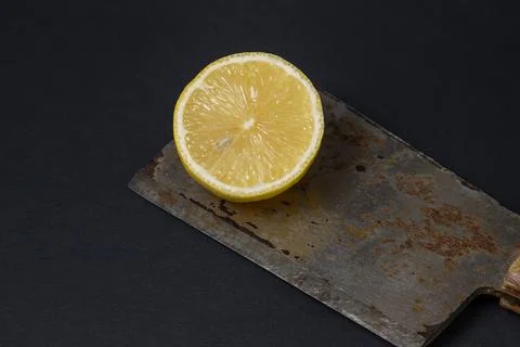 Lemons on a black background. Citrus fruit. Healthy food. Stock Photos