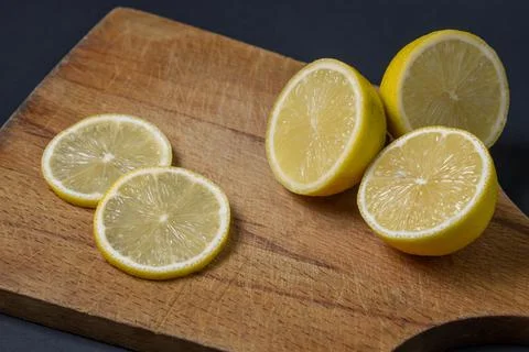 Lemons on a black background. Citrus fruit. Healthy food. Stock Photos