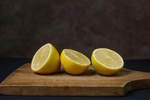 Lemons on a black background. Citrus fruit. Healthy food. Stock Photos