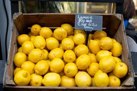Lemons in a box Stock Photos