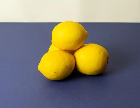 Lemons on dark blue table Stock Photos