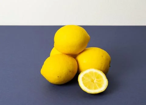 Lemons on dark blue table Stock Photos