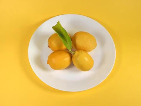 Lemons in a dish Stock Photos