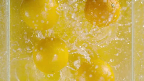 Lemons dropping into water 스톡 동영상 240140739