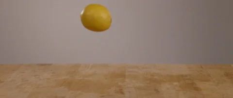Lemons Falling Onto Cutting Board In Slow Motion 스톡 동영상 105375743