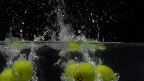 Lemons falling into the water with a big splash Stock Footage 123725075