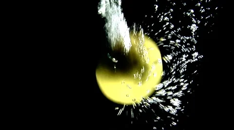 Lemons falling into water (black background) Stock Footage 8573829