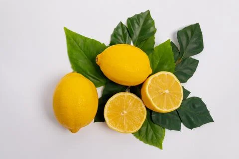 Lemons on a green background, space for text 스톡 사진