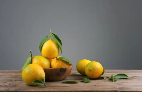 Lemons with green leafs Stock Photos