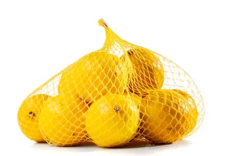 Lemons in a mesh bag Stock Photos