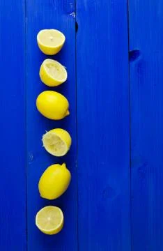 Lemons over blue background Stock Photos