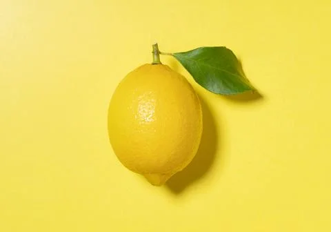 Lemons placed on a yellow background Stock Photos
