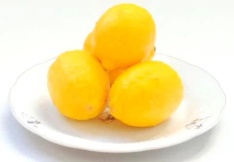 Lemons on a plate Stock Photos
