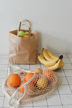 Lemons in reusable bag. Zero waste concept with string bag, mesh bag, grosery Stock Photos