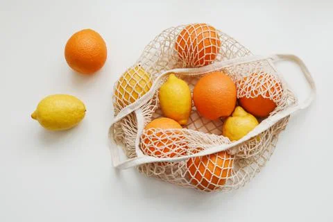 Lemons in reusable bag. Zero waste concept with string bag, mesh bag, grosery Stock Photos