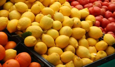 Lemons, tomatoes and oranges Stock Photos
