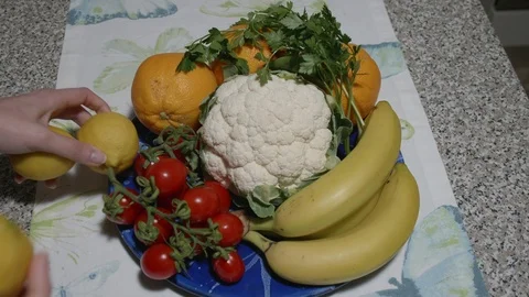 Lemons in a vegetables plate - Top View Stock Footage 124634473