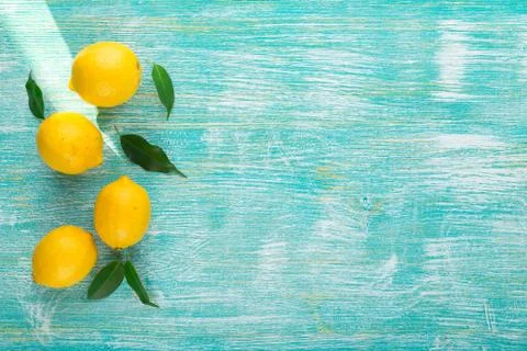Lemons on wooden table Stock Photos
