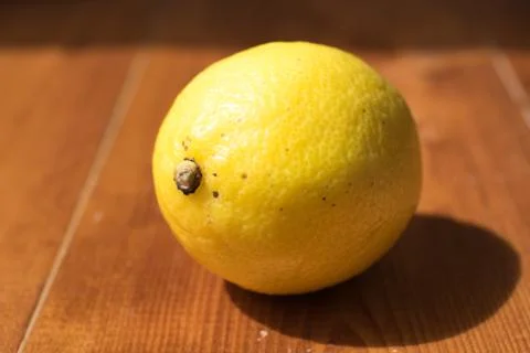 Lemons on a wooden table Stock Photos