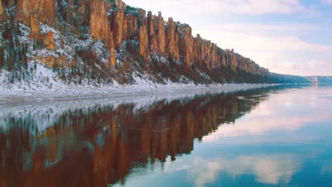 Lena Pillars reflecting in calm water during winter sunrise Stock Footage 337022346