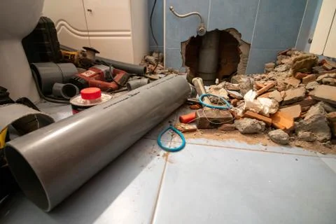 Length of plastic pipe for leaking pipe repairs to a small bathroom in Coruna Stock Photos