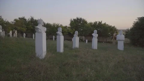 Lenin statues and busts in open-air museum of the Soviet period on sunset Stock-Footage 94953888