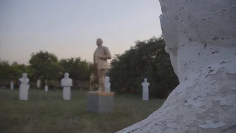 Lenin statues and busts in open-air museum of the Soviet period on sunset Stock-Footage 94953939