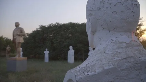 Lenin statues and busts in open-air museum of the Soviet period on sunset Stock-Footage 94954357