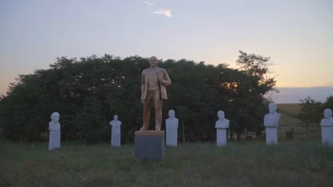 Lenin statues and busts in open-air museum of the Soviet period on sunset Stock-Footage 94959605