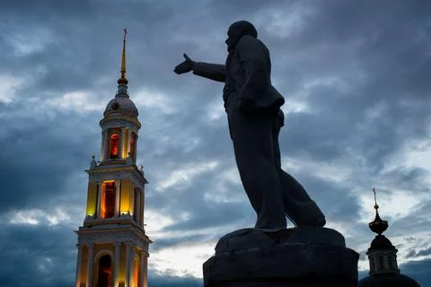 Lenin's monument on the background of St. John the Theologian Church in Kolom Stock Photos