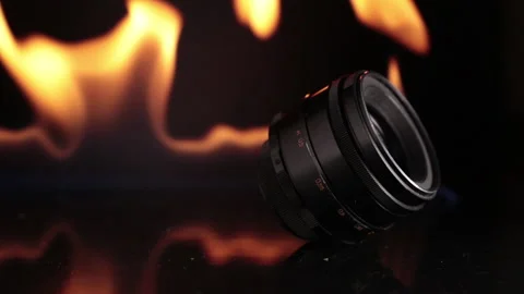 Lens for the camera on the background of fire Stock Footage 151835669