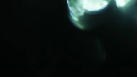 Lens Flare, Abstract Bokeh Lights Moving. Leaking Reflection of a Glass. Stock Footage 135499862
