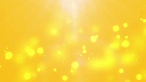 Lens flare and floating gold embers on orangey yellow Stock Footage 241526375