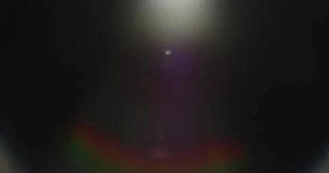Lens flare on black background Stock Footage 235472084
